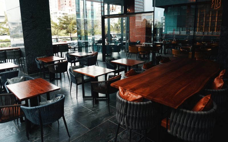 Interior of The Revolution Bar in Baner, Pune, showing integrated architectural speakers for day-to-night transitions.