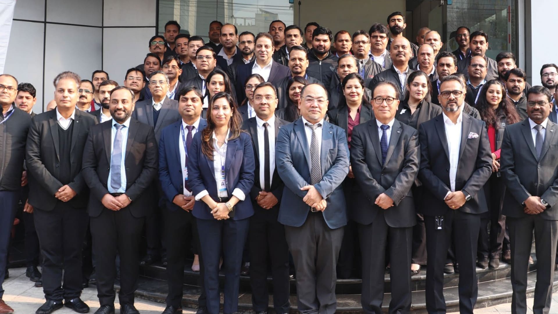 Teachers receiving hands-on technical training from Sharp India experts on how to use digital office solutions and interactive tools.