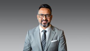 Primary school students in a rural Haryana classroom actively participating in a digital lesson using a Sharp interactive screen.