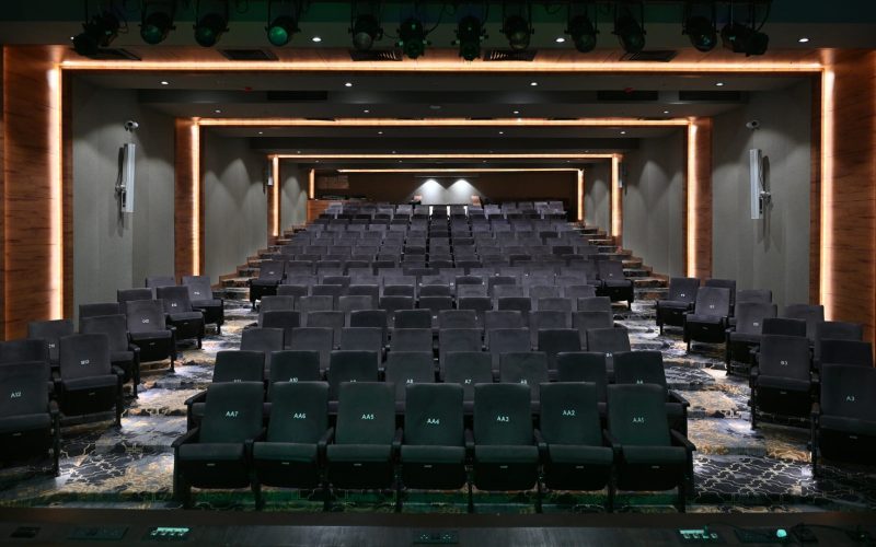 Wide view of Shashwathi Auditorium at NMKRV Institute of Legal Studies featuring d&b audiotechnik column speakers.