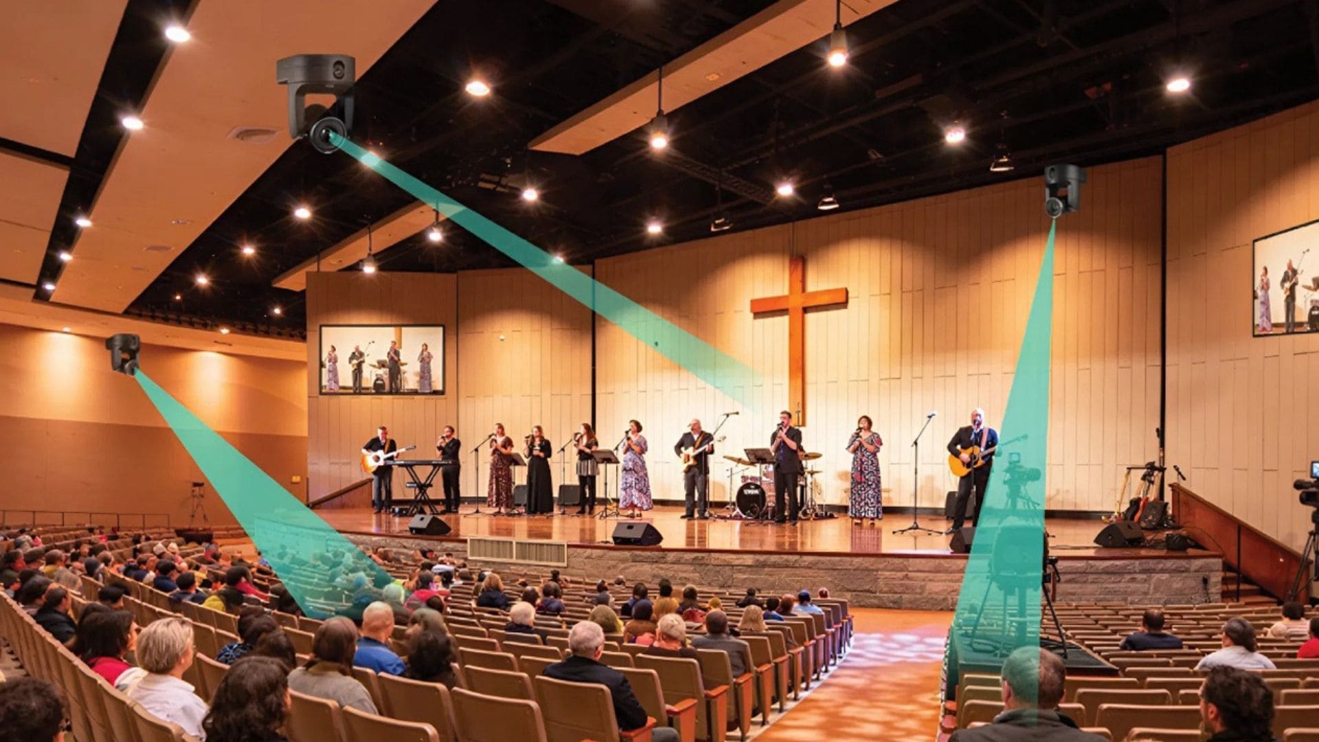 A person at home watching a live-streamed Sunday service on a laptop, with the physical church sanctuary visible on the screen.