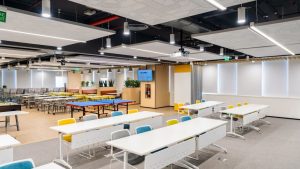 The executive boardroom at Grid Dynamics equipped with distributed ceiling speakers and professional wireless microphones.