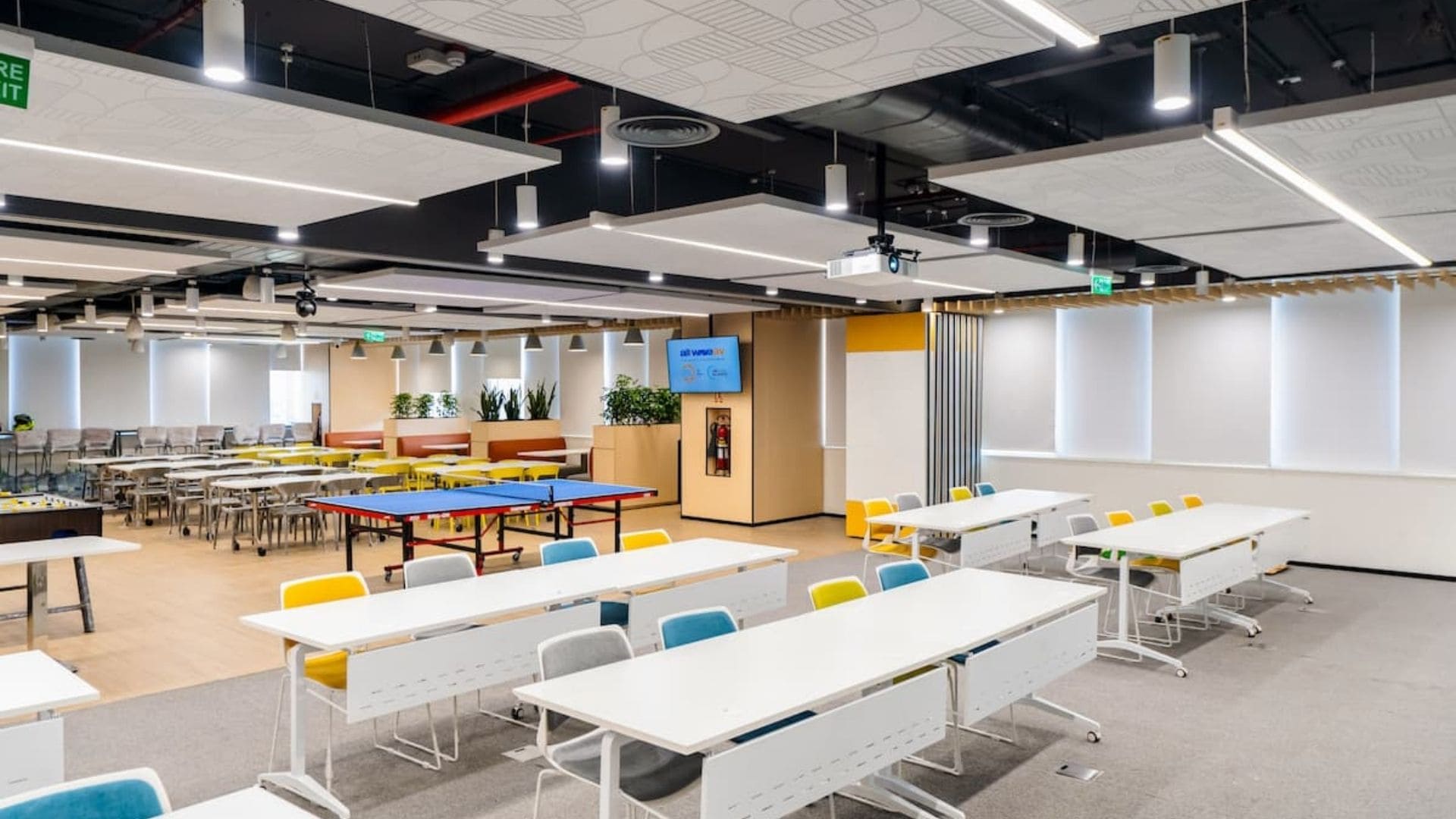 The executive boardroom at Grid Dynamics equipped with distributed ceiling speakers and professional wireless microphones.