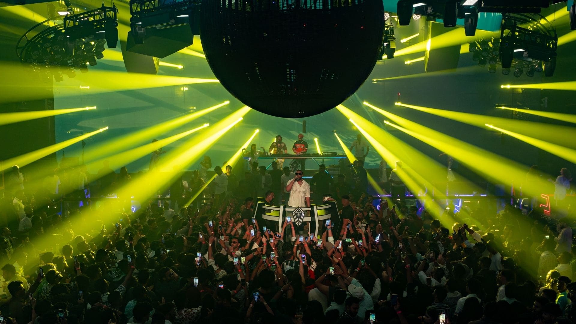 A professional DJ booth setup showing the monitoring system and Ionic stagebox connectivity for touring artists.