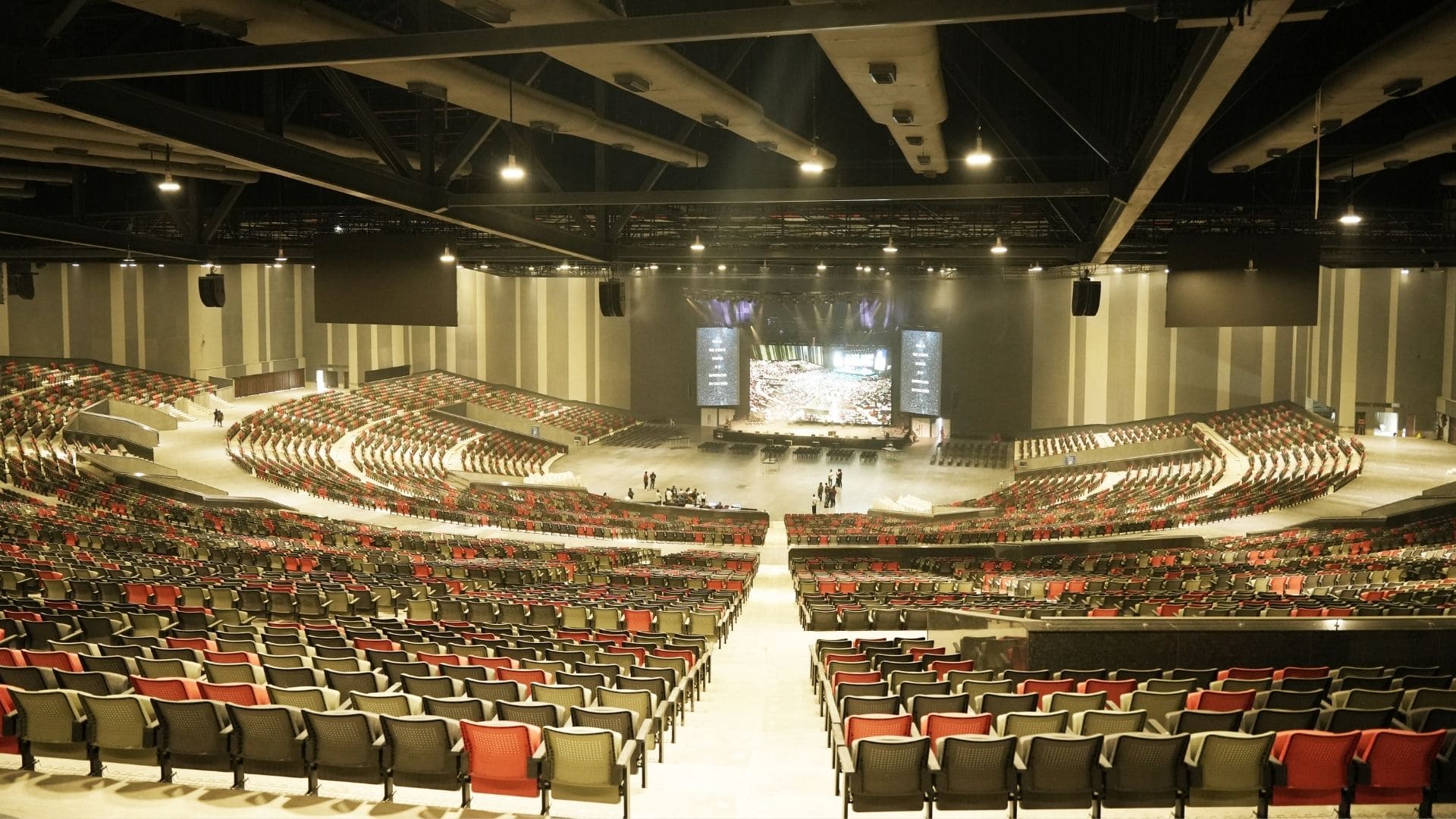 Wide-angle view of the semicircular 25,000-seat New Life Worship Centre auditorium in Chennai showing the massive scale and pillar-less design.