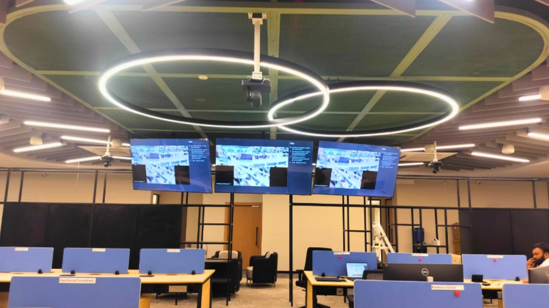 Professional Town Hall AV installation featuring QSC Core 110f DSP and enterprise conferencing infrastructure.