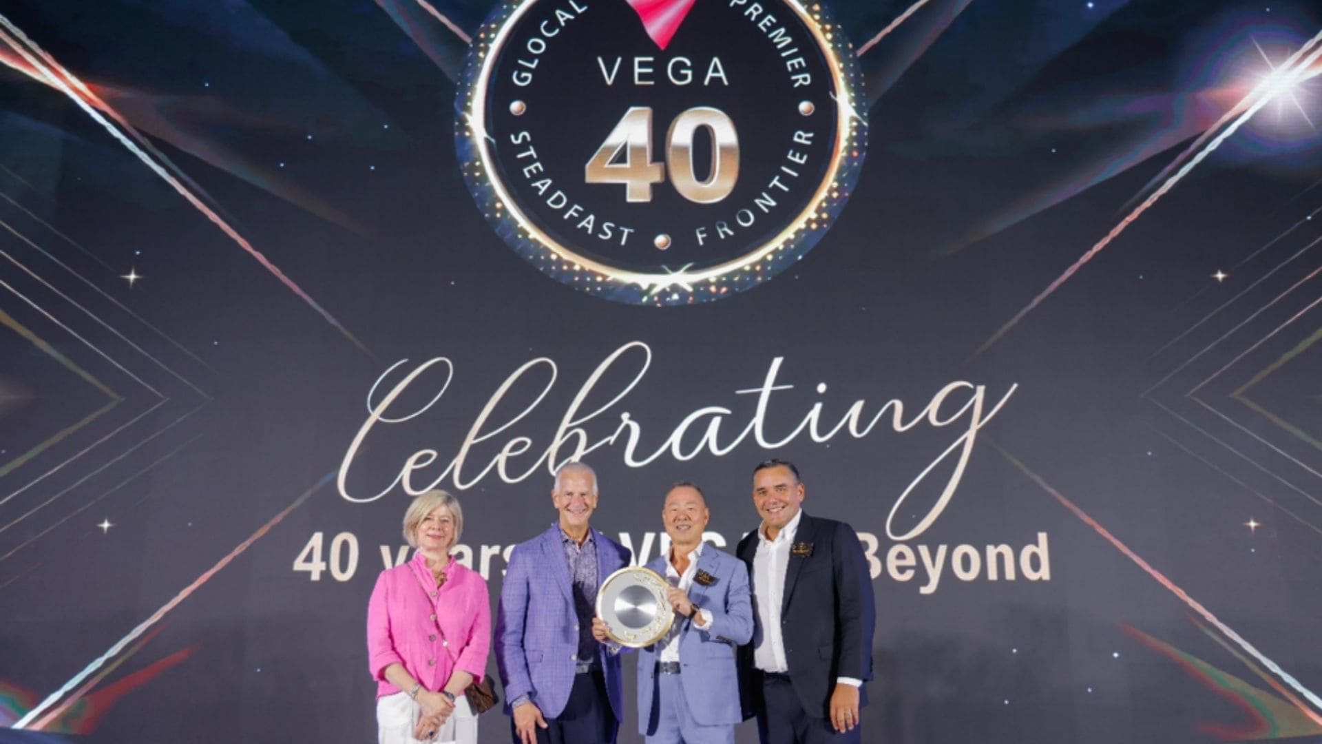 AVIXA CEO David Labuskes and Chief Global Officer Sarah Joyce presenting a commemorative gift to VEGA.