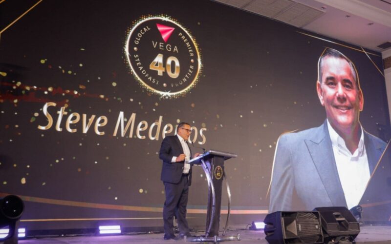 Blessing Joseph presenting VEGA's business expansion across India, the Middle East, and Africa during the anniversary event.